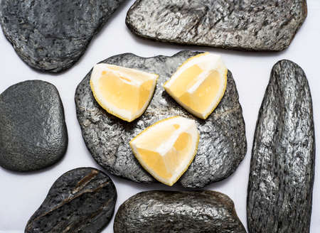 Fresh and juicy lemons cut on white backgroundの写真素材