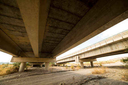 Large concrete beams under a highwayの写真素材