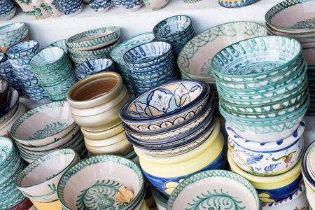 Colorful ceramic pottery for sale at local market in Portugal.