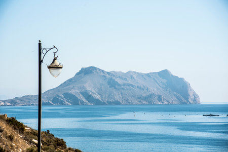 Cabo de cope with marine style lamppost, from the yellow beach, Aguilas, Spainの写真素材