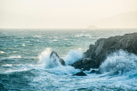 Beautiful seascape with waves crashing against the rocks. Toned.の写真素材