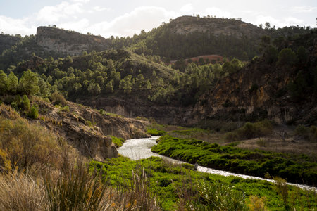 Mountain landscape with a river in the foreground, Spain, Andalusiaの写真素材
