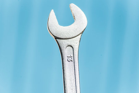 Spanner on a blue background close-up macro photography.の写真素材