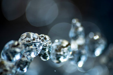 Macro shot of ice crystals on a dark background with bokeh