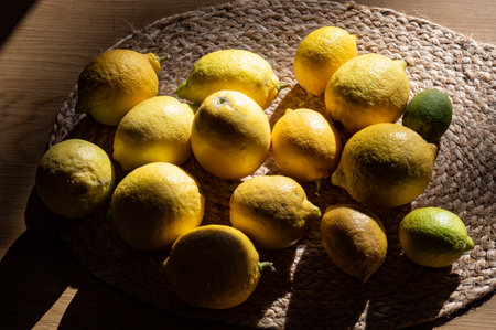 Lemons and lemons on a wooden background. Toned.の写真素材