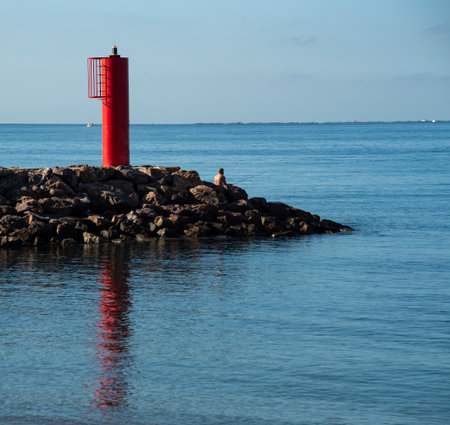 Red lighthouse on the coast.の写真素材