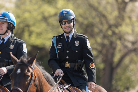 Washington, D.C., USA - April 14, 2018 Police officers riding horses in the 2018 National Cherry Blossom Paradeのeditorial素材