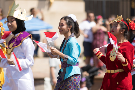 Washington, D.C., USA - April 14, 2018 People from Indonesia wearing traditional clothing walking down the street in the 2018 National Cherry Blossom Paradeのeditorial素材