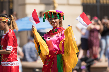 Washington, D.C., USA - April 14, 2018 People from Indonesia wearing traditional clothing walking down the street in the 2018 National Cherry Blossom Paradeのeditorial素材