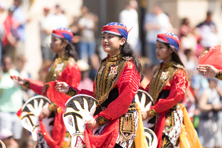 Washington, D.C., USA - April 14, 2018 People from Indonesia wearing traditional clothing walking down the street in the 2018 National Cherry Blossom Paradeのeditorial素材