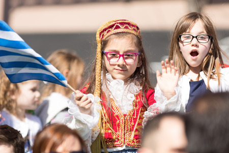 Chicago, Illinois, USA - April 29, 2018  Children wearing traditional clothing waving the greek flag at the Greek Independence  Day Paradeのeditorial素材