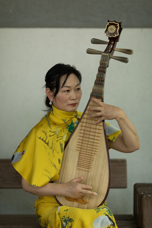 Columbus, Ohio, USA - May 27, 2018 A member of the Hefei Artists Group plays the pipa at the Asian Festival.のeditorial素材