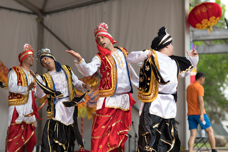 Columbus, Ohio, USA - May 27, 2018  A group of Bhangra dancers perform at the Asian Festival and the public join them in the dancing.のeditorial素材