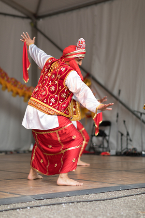 Columbus, Ohio, USA - May 27, 2018  A group of Bhangra dancers perform at the Asian Festival and the public join them in the dancing.のeditorial素材