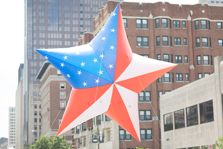 Indianapolis, Indiana, USA - May 26, 2018, Members of the Gold Star Families of Indiana carry a giant balloon in shape of a star with the colors of the American Flag at the Indy 500 Paradeのeditorial素材