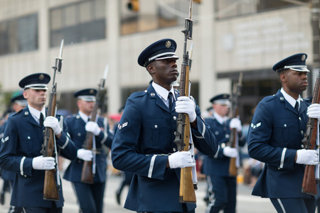 Indianapolis, Indiana, USA - May 26, 2018, Members of the US Air Force march in formation with rifles down the road at the Indy 500 Paradeのeditorial素材