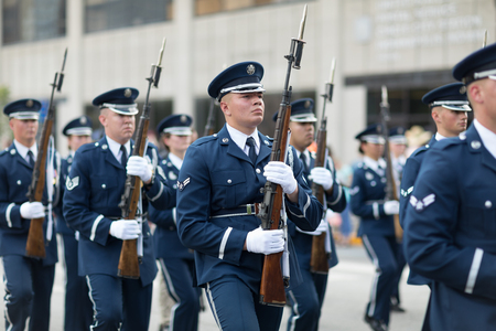 Indianapolis, Indiana, USA - May 26, 2018, Members of the US Air Force march in formation with rifles down the road at the Indy 500 Paradeのeditorial素材