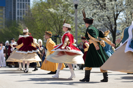 Chicago, Illinois, USA - May 05, 2018 Members of Polonia, polish folk song and dance ensemble, wearing traditional clothing, perform polish traditional dancing at the Grant Park, after the Polish Constitution Day Parade.のeditorial素材