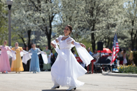 Chicago, Illinois, USA - May 05, 2018 Members of Polonia, polish folk song and dance ensemble, wearing traditional clothing, perform polish traditional dancing at the Grant Park, after the Polish Constitution Day Parade.のeditorial素材
