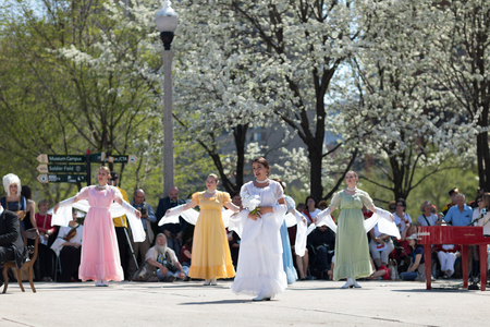 Chicago, Illinois, USA - May 05, 2018 Members of Polonia, polish folk song and dance ensemble, wearing traditional clothing, perform polish traditional dancing at the Grant Park, after the Polish Constitution Day Parade.のeditorial素材