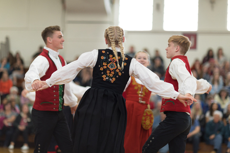 Stoughton, Wisconsin, USA - May 19, 2018 The Stoughton Norwegian Dancers, wearing traditional clothing from norway, perform traditional dances at the Community Building Performance, during the Syttende Mai Stoughton festival, Norwegian Constitution Day.のeditorial素材