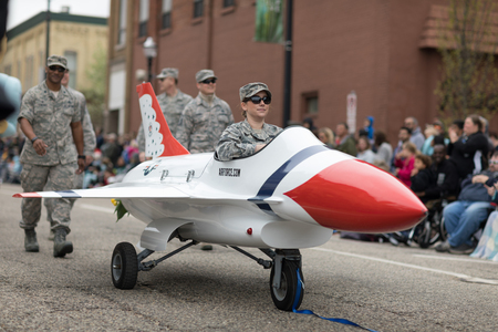 Holland, Michigan, USA - May 12, 2018 Members of the US Air Force ride a miniature F-16 jet...
