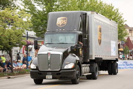 Frankenmuth, Michigan, USA - June 10, 2018 UPS Trucks going down the road at the Bavarian Festival...