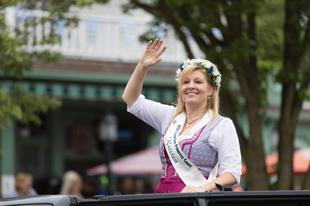 Frankenmuth, Michigan, USA - June 10, 2018 Past Bavarian Festival  Princess and court members wearing traditional german clothing going down the road on cars at the Bavarian Festival Parade.のeditorial素材
