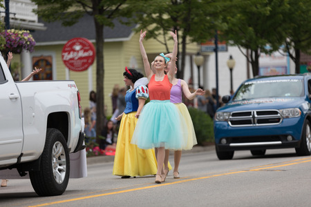 Frankenmuth, Michigan, USA - June 10, 2018 Members of Everafter West Michigan dress up as disney princess at the Bavarian Festival Parade.のeditorial素材