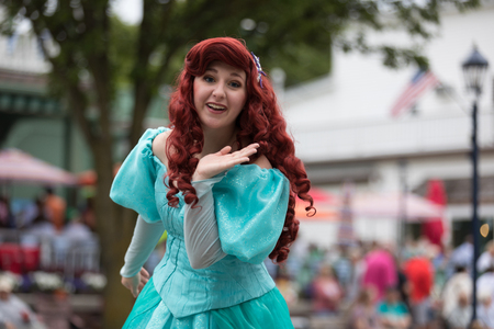 Frankenmuth, Michigan, USA - June 10, 2018 Members of Everafter West Michigan dress up as disney princess at the Bavarian Festival Parade.のeditorial素材