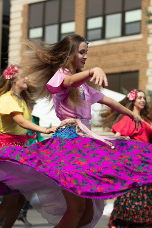 Whiting, Indiana, USA - July 28, 2018 Men and women wearing traditional slovak clothing perform traditional slovak gypsy dance at the Pierogi Festのeditorial素材