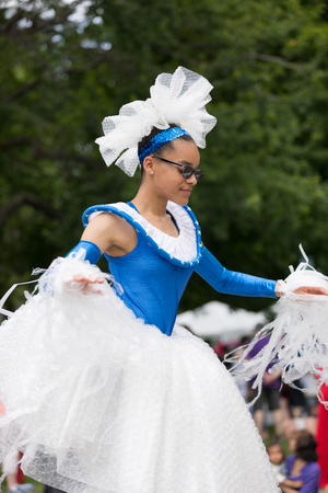 Cleveland, Ohio, USA - June 9, 2018 woman on stilts wearing colorful outfit At the abstract art festival Parade The Circleのeditorial素材