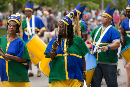 Cleveland, Ohio, USA - June 9, 2018 african american women and man playing drums At the abstract art...