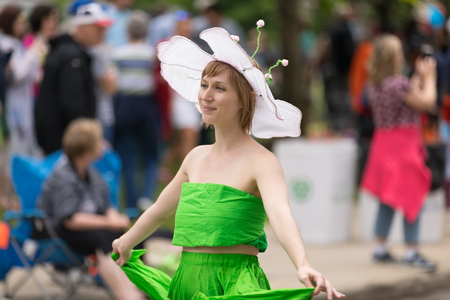 Cleveland, Ohio, USA - June 9, 2018 woman dress up as a flower dancing At the abstract art festival Parade The Circleのeditorial素材