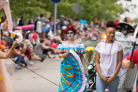 Cleveland, Ohio, USA - June 9, 2018 Men and women wearing traditional mexican clothing and face paint, like sugar skulls At the abstract art festival Parade The Circleのeditorial素材
