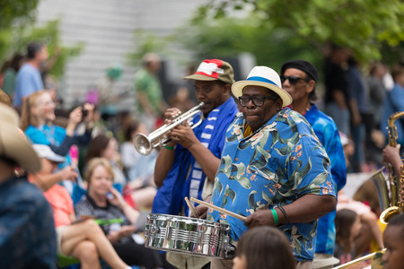 Cleveland, Ohio, USA - June 9, 2018 African american man playing the drum At the abstract art...
