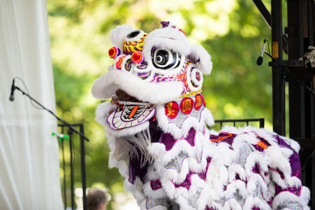 St. Louis, Missouri, USA - August 26, 2018: The Festival of Nations, Men women and children from the  International Shaolin Wushu Center perfrom traditional chinese lion dance.のeditorial素材