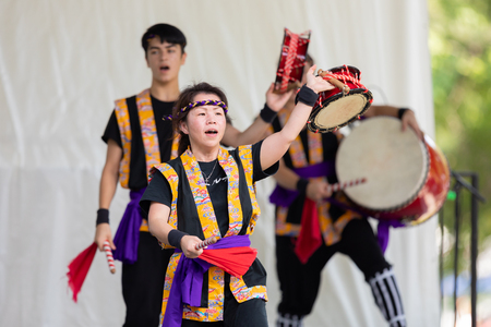 St. Louis, Missouri, USA - August 26, 2018: The Festival of Nations, Asian men and women from the St. Louis Eisa Okinawa Kenjin-kai perfrom traditional okinawan drum danceのeditorial素材