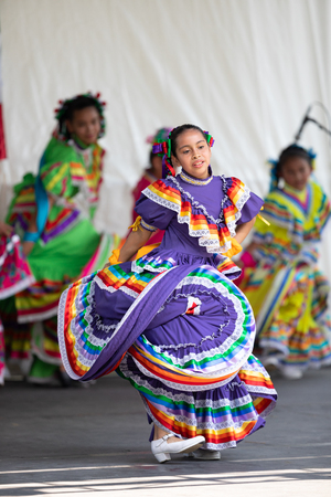 St. Louis, Missouri, USA - August 26, 2018: The Festival of Nations, Women and children from the Mexican Dance Ministerio Guadalupe perfrom traditional Mexican dances.のeditorial素材