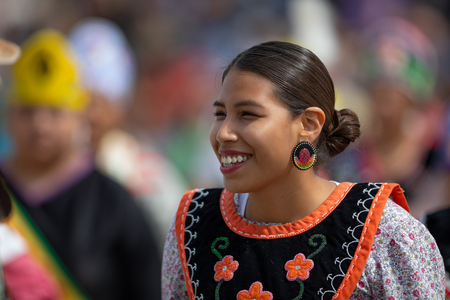 Milwaukee, Wisconsin, USA - September 8, 2018 The Indian Summer Festival Young woman wearing traditional native american clothing at the pow wow competition.のeditorial素材