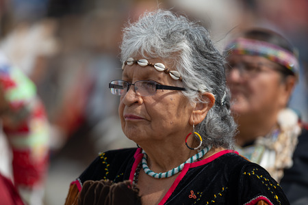 Milwaukee, Wisconsin, USA - September 8, 2018 The Indian Summer Festival, Woman wearing traditional native american clothing at the pow wow competition.のeditorial素材