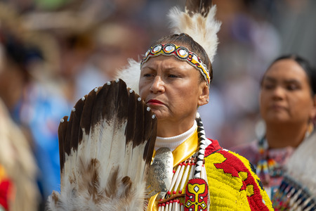 Milwaukee, Wisconsin, USA - September 8, 2018 The Indian Summer Festival, Woman wearing traditional native american clothing at the pow wow competition.のeditorial素材