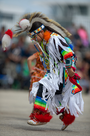 Milwaukee, Wisconsin, USA - September 8, 2018 The Indian Summer Festival, Child wearing traditional native american clothing, dancing at the pow wow competition.のeditorial素材