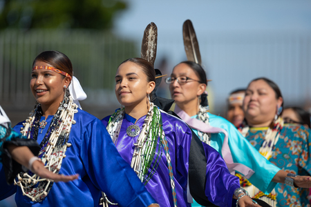 Milwaukee, Wisconsin, USA - September 8, 2018 The Indian Summer Festival, Young woman wearing traditional native american clothing, dancing at the pow wow competition.のeditorial素材