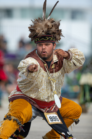 Milwaukee, Wisconsin, USA - September 8, 2018 The Indian Summer Festival, Man wearing traditional native american clothing, dancing at the pow wow competition.のeditorial素材