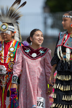 Milwaukee, Wisconsin, USA - September 8, 2018 The Indian Summer Festival, boy and girls wearing traditional native american clothing.のeditorial素材