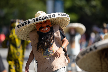 Washington, D.C., USA - September 29, 2018: The Fiesta DC Parade, Mexican man wearing an abstract face mask and a big sombreroのeditorial素材