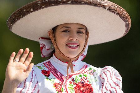 Washington, D.C., USA - September 29, 2018: The Fiesta DC Parade, Mexican woman dress up as charro, riding a horse and wearing traditional clothingのeditorial素材