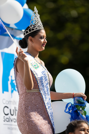 Washington, D.C., USA - September 29, 2018: The Fiesta DC Parade, Beauty queen from El Salvador waving the National flag from El Salvadorのeditorial素材