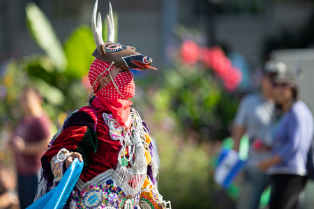 Washington, D.C., USA - September 29, 2018: The Fiesta DC Parade, Man from Guatemala wearing traditional clothing and wearing a hat in shape of a deerのeditorial素材